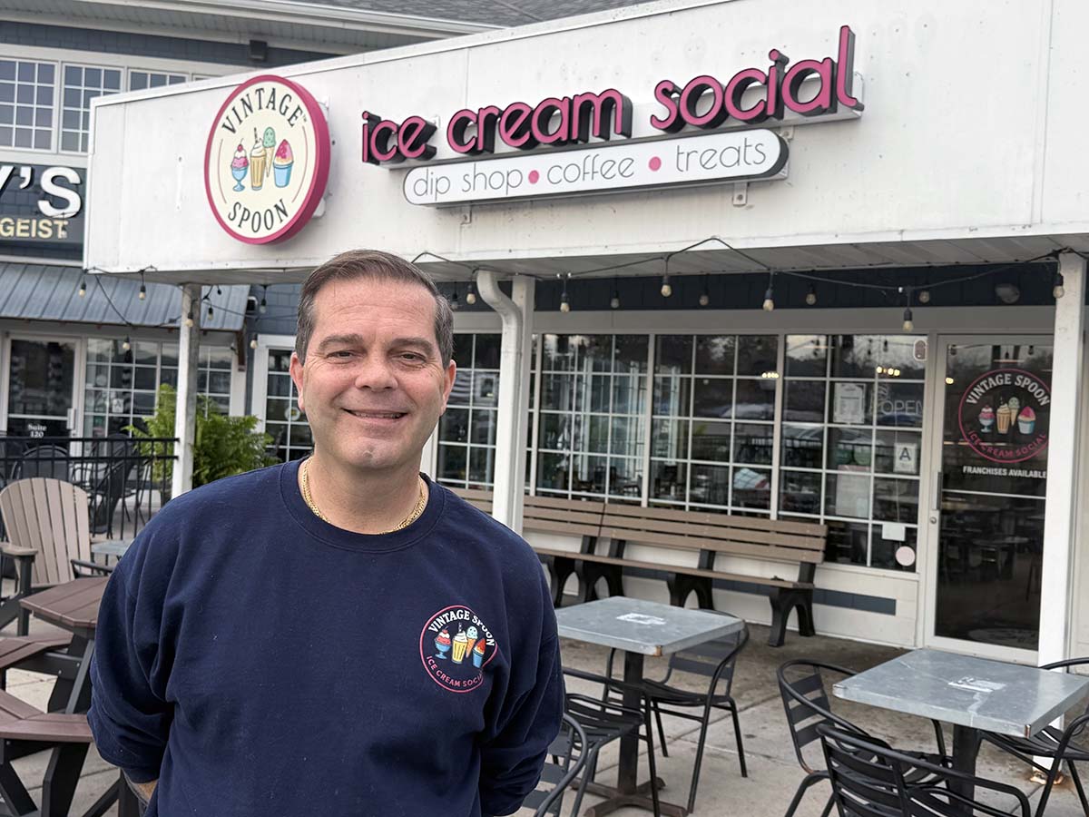 Chris Collins in front of the Vintage Spoon at Geist Marina